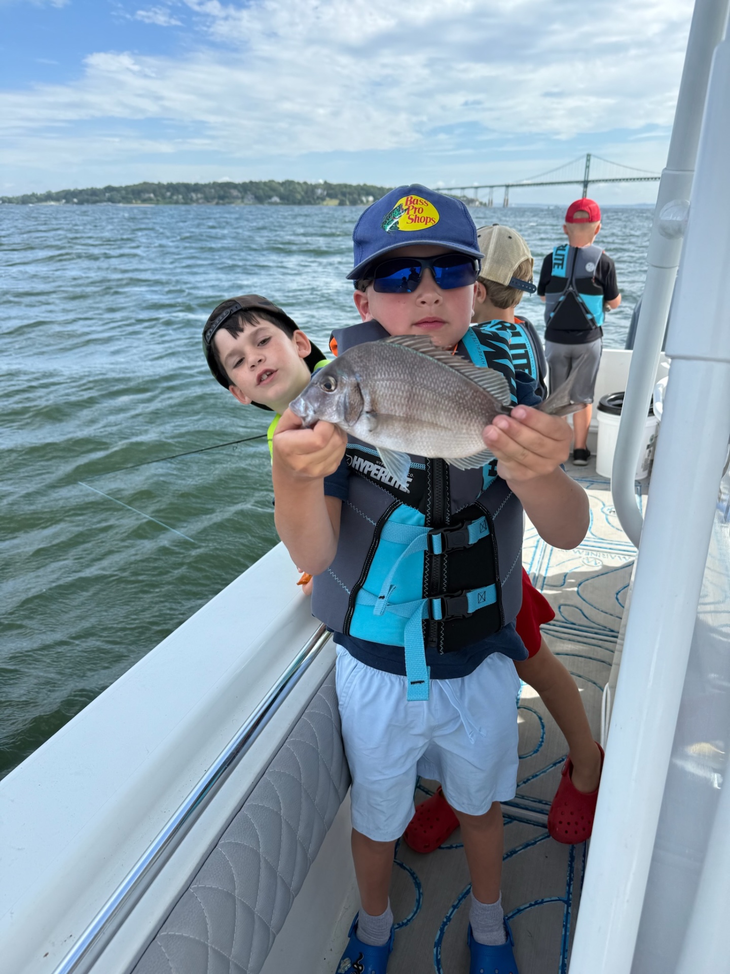 Academy campers with a scup on the bay