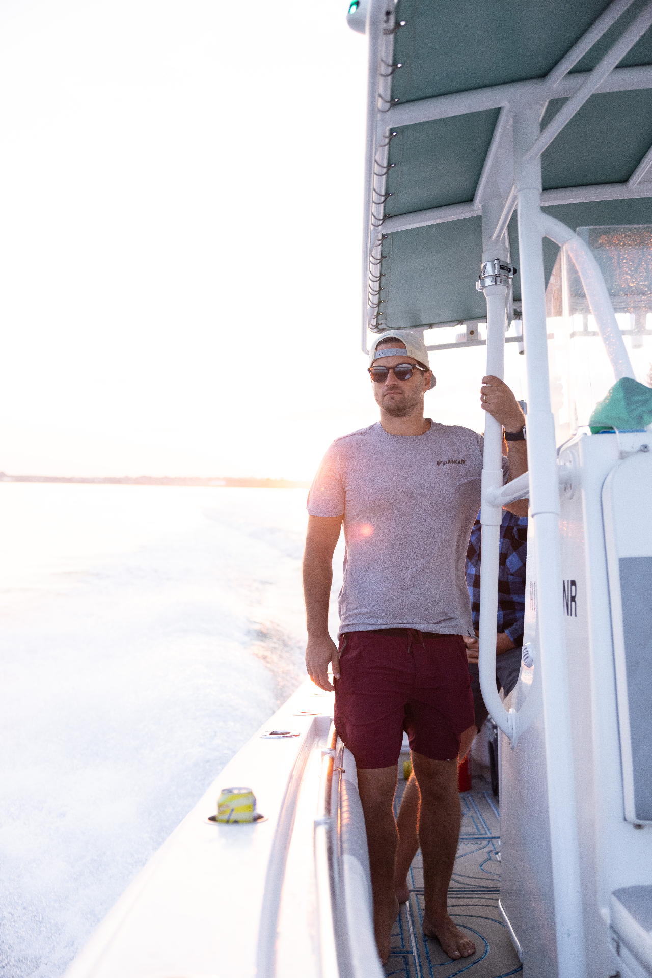 Angler on deck in the golden hour light