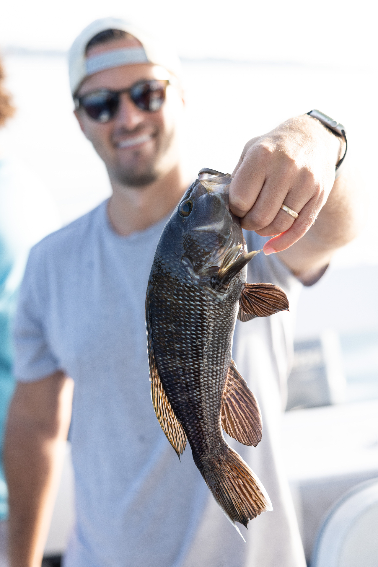 Angler holding up a Narragansett Bay tautog